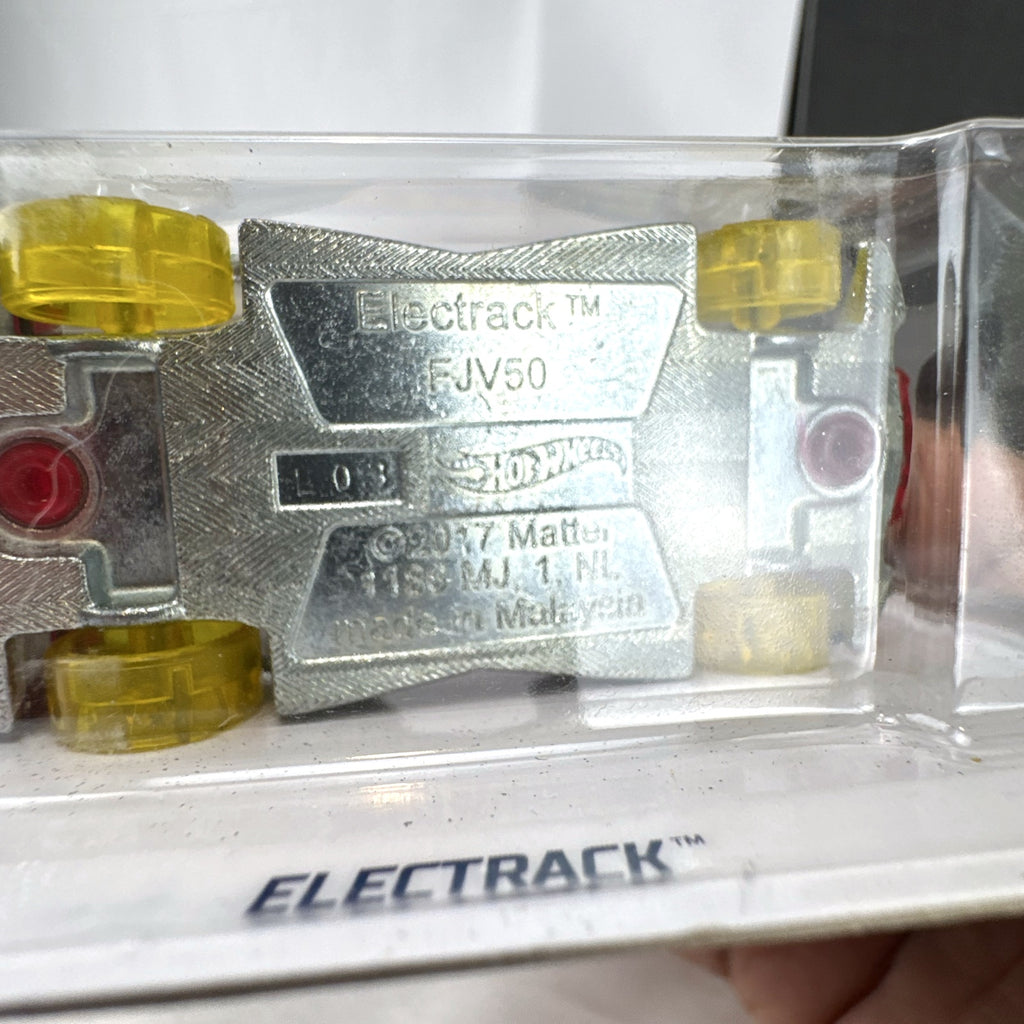 Hot Wheels Electrack diecast car in translucent red from the X-Raycers series factory sealed on card.