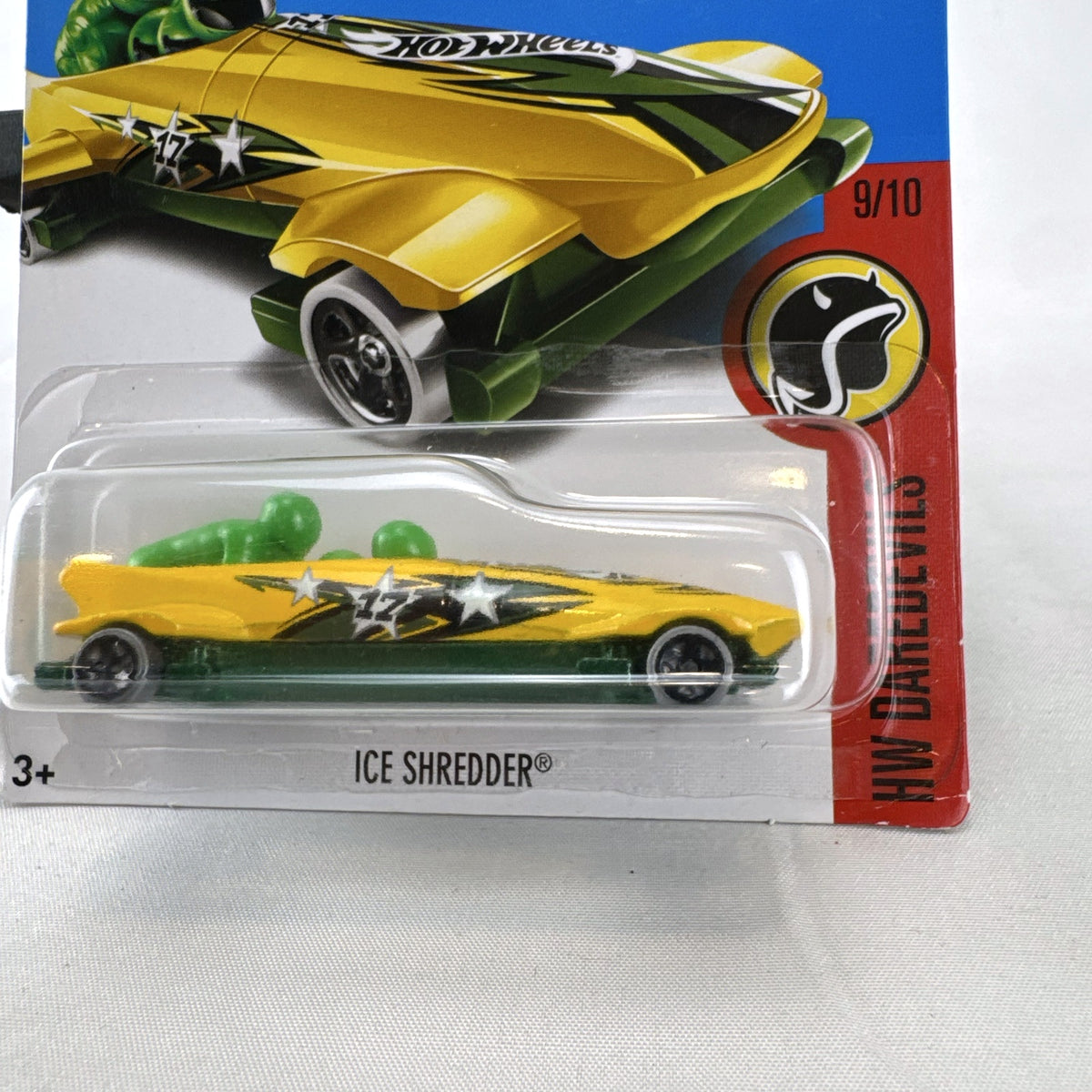 Hot Wheels Ice Shredder diecast bobsled vehicle in yellow and green, factory sealed on original HW Daredevils card.