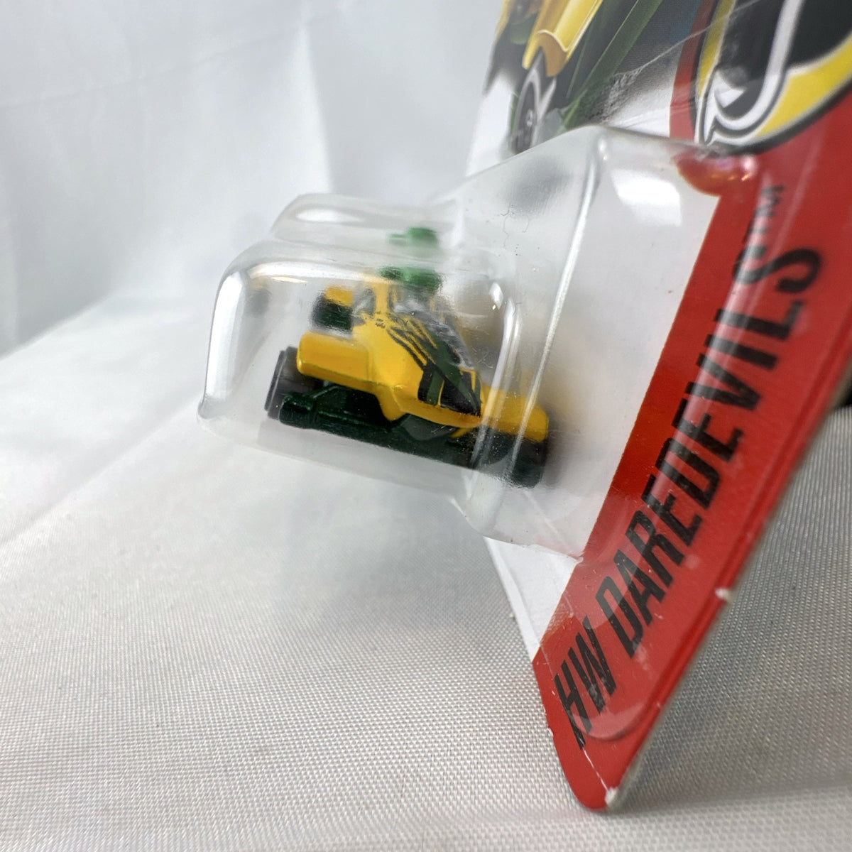 Hot Wheels Ice Shredder diecast bobsled vehicle in yellow and green, factory sealed on original HW Daredevils card.