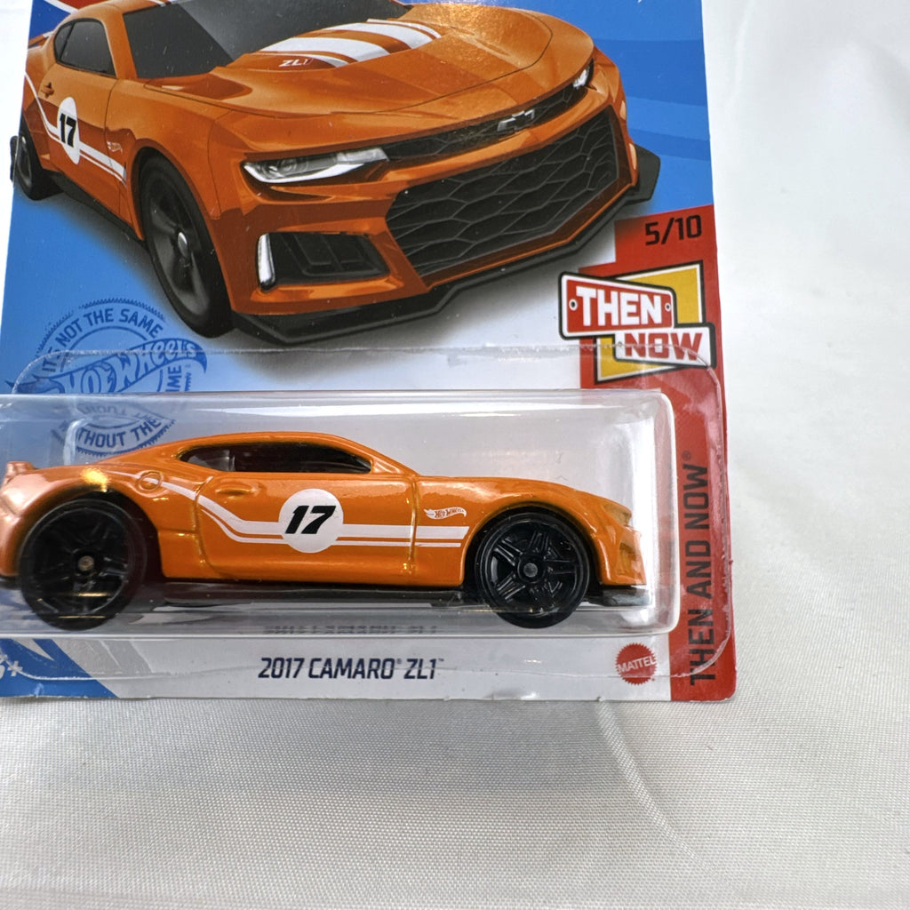 Carded Hot Wheels 1:64 scale 2017 Chevrolet Camaro ZL1 diecast car in orange with white racing stripes