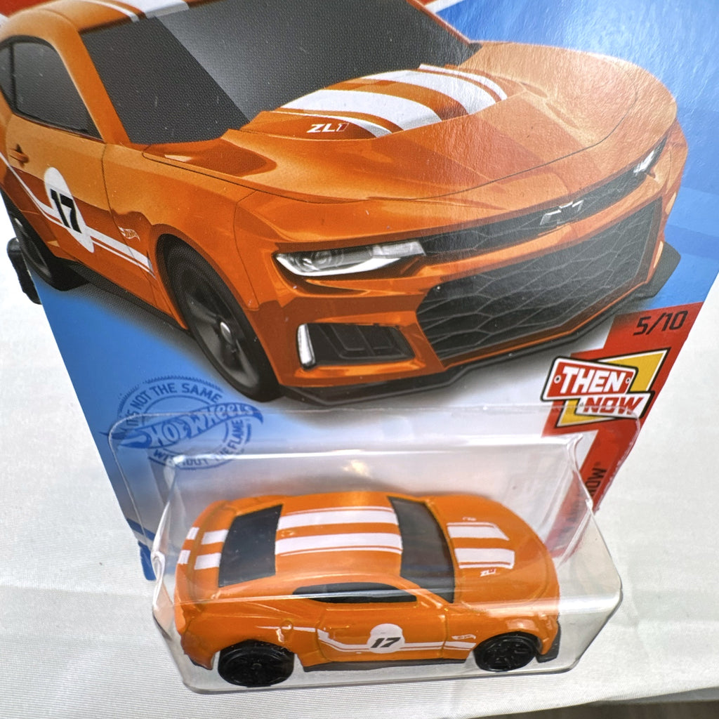Carded Hot Wheels 1:64 scale 2017 Chevrolet Camaro ZL1 diecast car in orange with white racing stripes