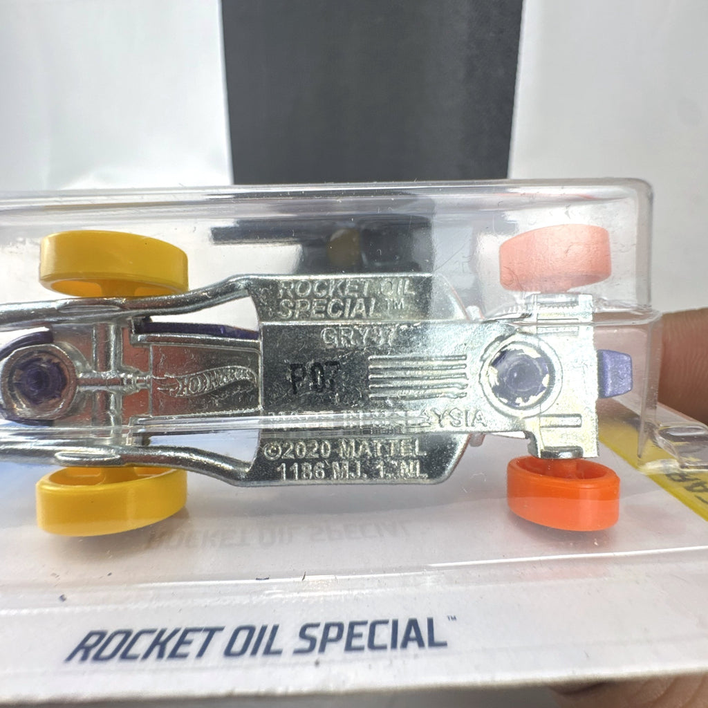 Hot Wheels 1:64 scale Rocket Oil Special diecast streamliner in purple art splatter card packaging