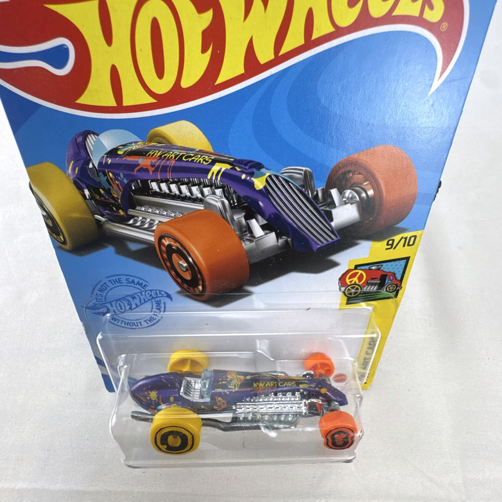 Hot Wheels 1:64 scale Rocket Oil Special diecast streamliner in purple art splatter card packaging