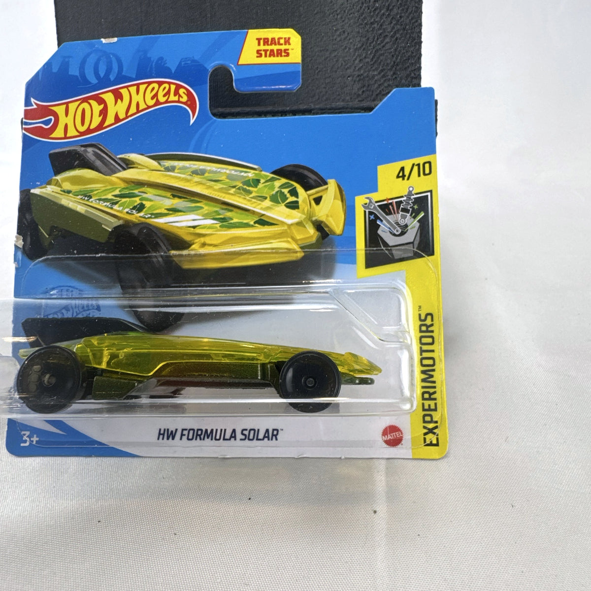 Hot Wheels 1:64 scale HW Formula Solar diecast car in translucent yellow on original blister card