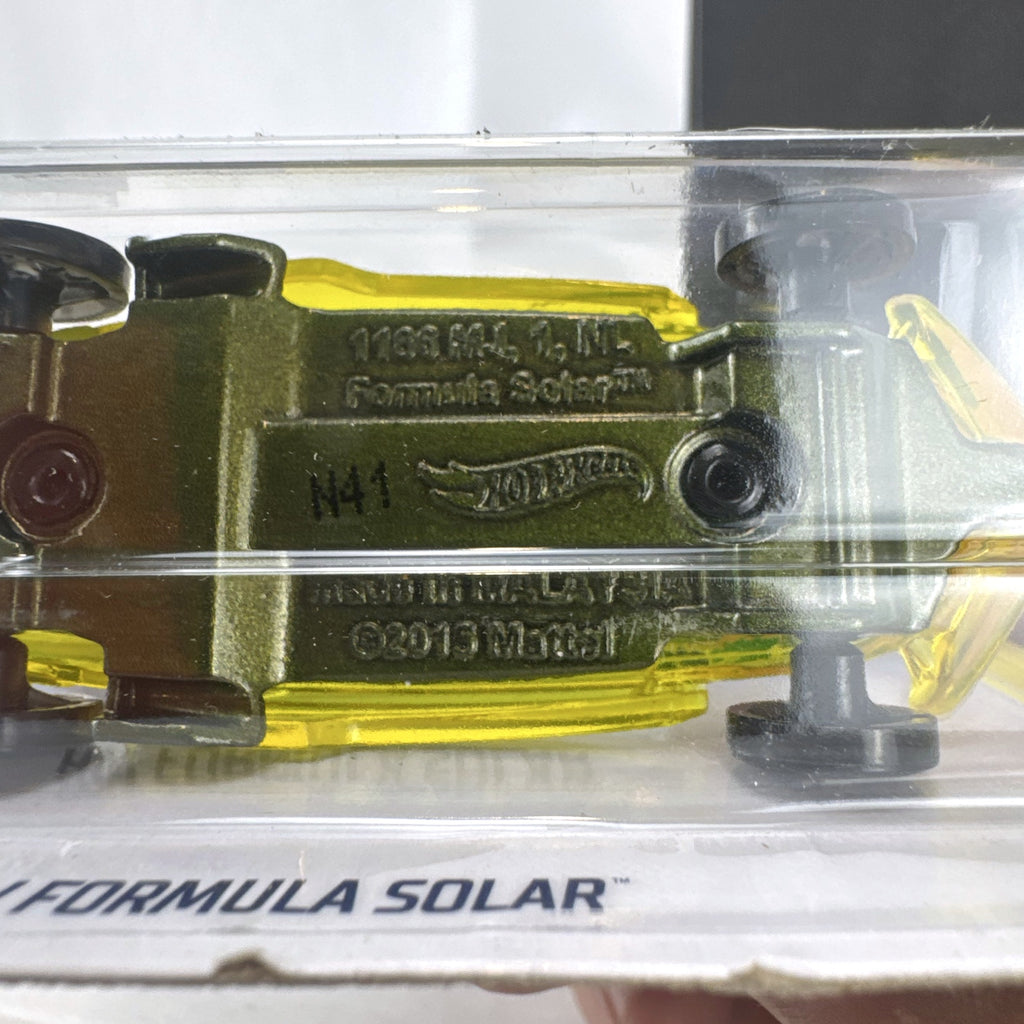 Hot Wheels 1:64 scale HW Formula Solar diecast car in translucent yellow on original blister card