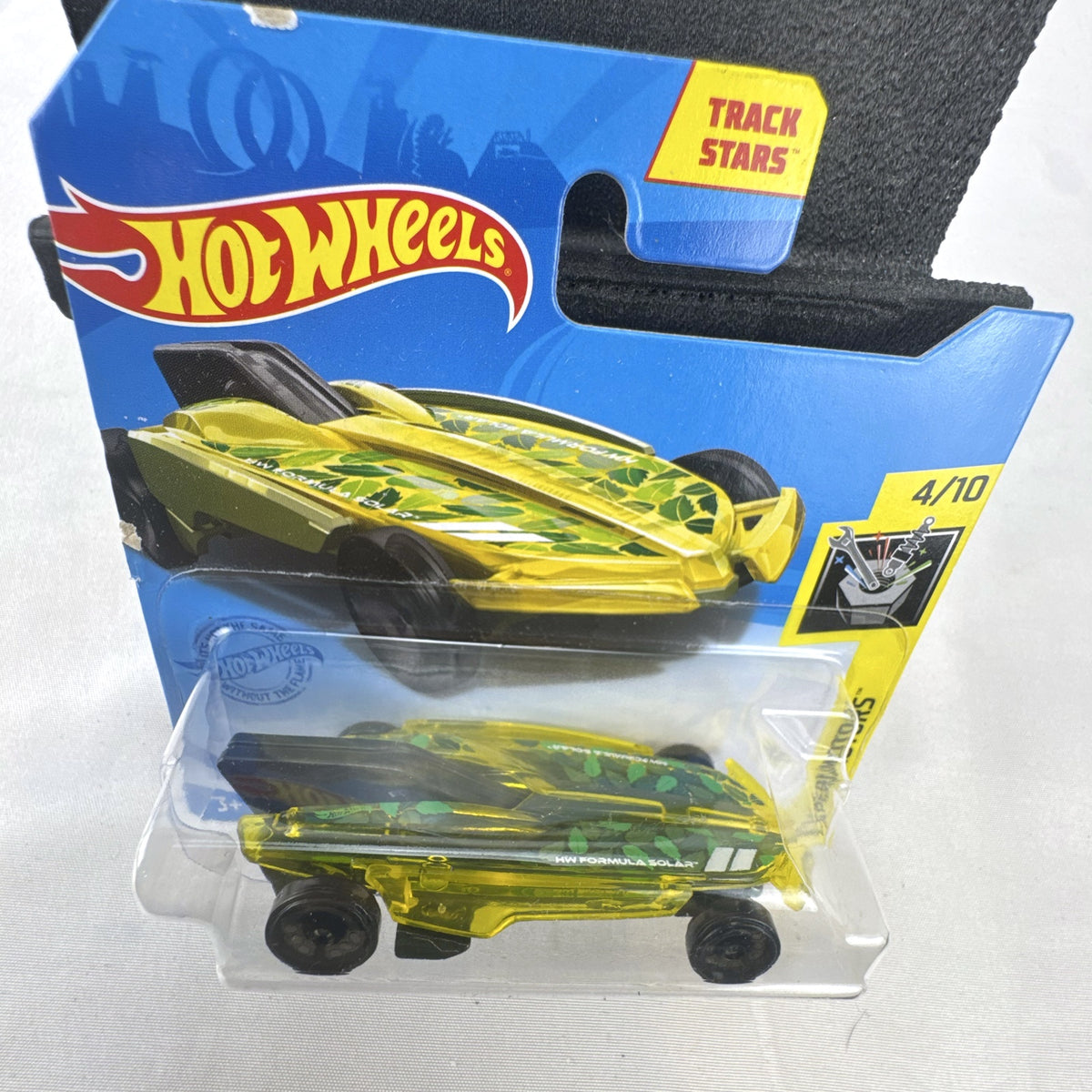 Hot Wheels 1:64 scale HW Formula Solar diecast car in translucent yellow on original blister card