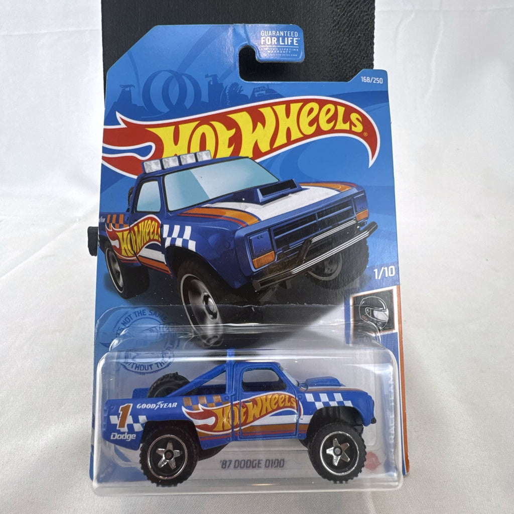 Hot Wheels 1987 Dodge D100 pickup truck in Race Team blue on blister card