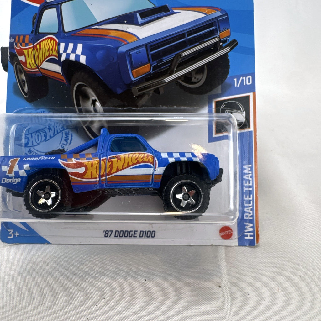 Hot Wheels 1987 Dodge D100 pickup truck in Race Team blue on blister card