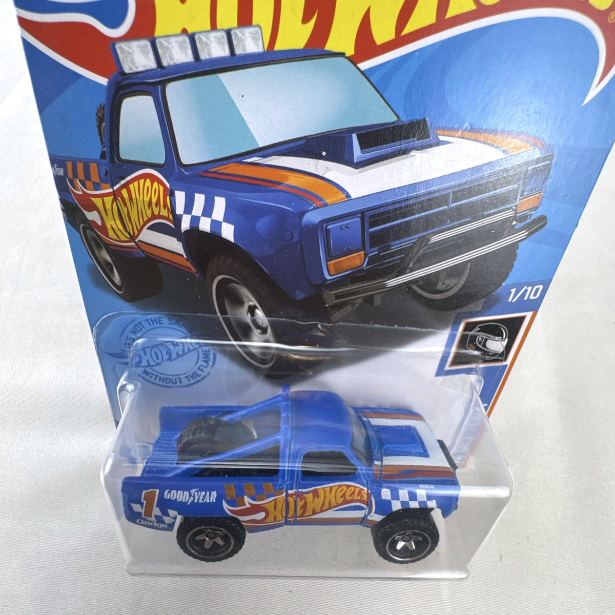 Hot Wheels 1987 Dodge D100 pickup truck in Race Team blue on blister card