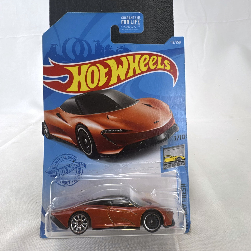 Hot Wheels McLaren Speedtail 1:64 die-cast car in metallic orange, factory sealed on original card.