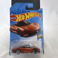 Hot Wheels 1:64 scale 2020 McLaren Speedtail diecast car in metallic orange on original Factory Fresh blister card.