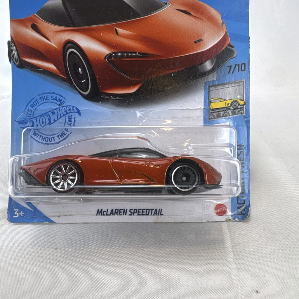 Hot Wheels McLaren Speedtail 1:64 die-cast car in metallic orange, factory sealed on original card.