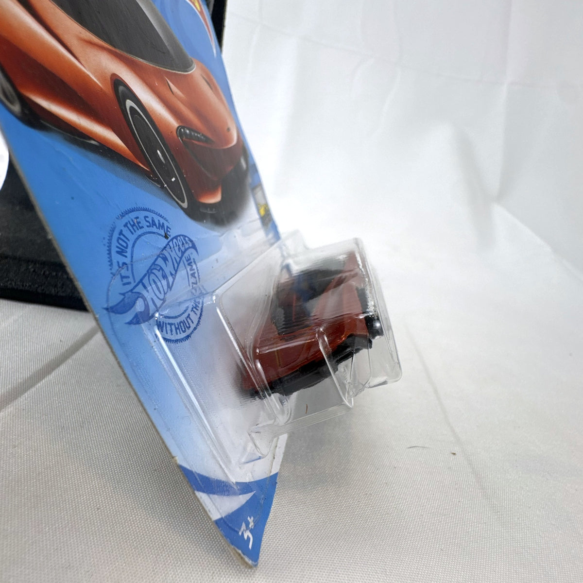 Hot Wheels McLaren Speedtail 1:64 die-cast car in metallic orange, factory sealed on original card.