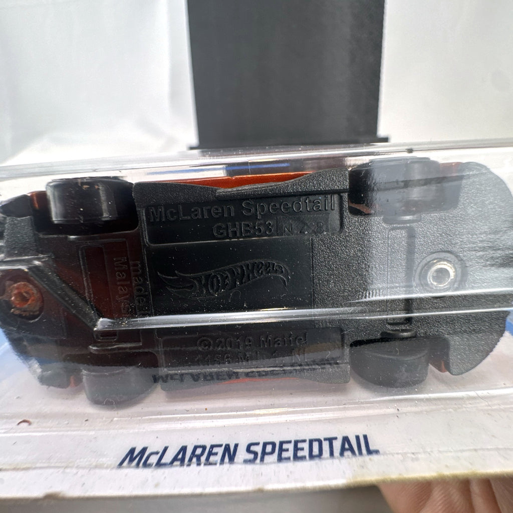 Hot Wheels McLaren Speedtail 1:64 die-cast car in metallic orange, factory sealed on original card.