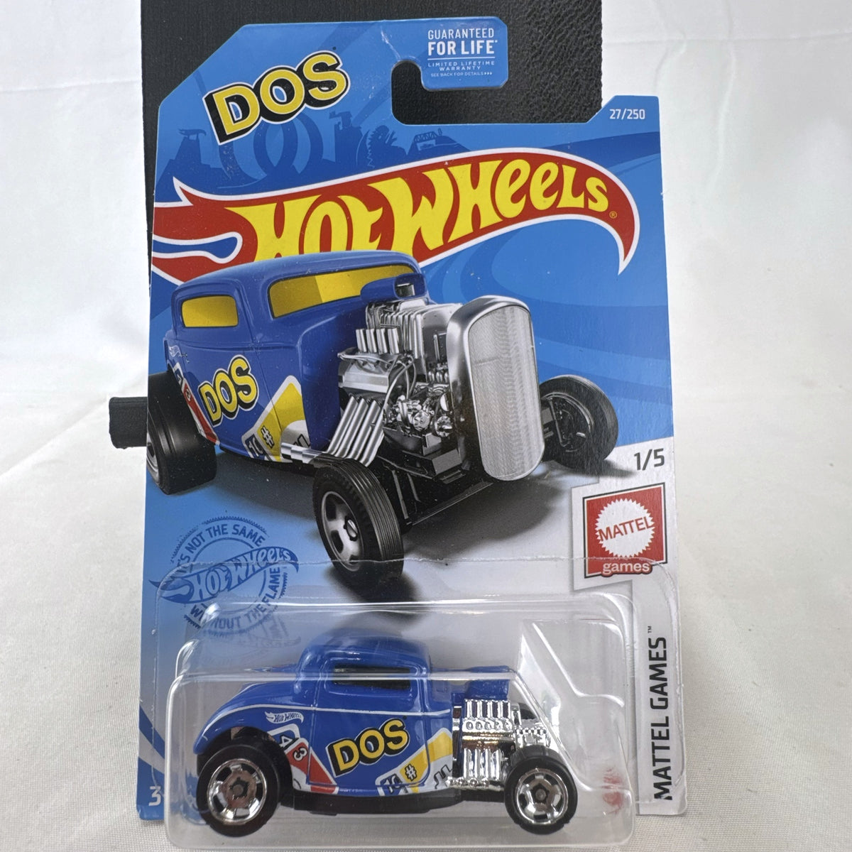 Sealed Hot Wheels 1932 Ford Coupe diecast car in blue with Mattel Games DOS card game graphics on original blister card.