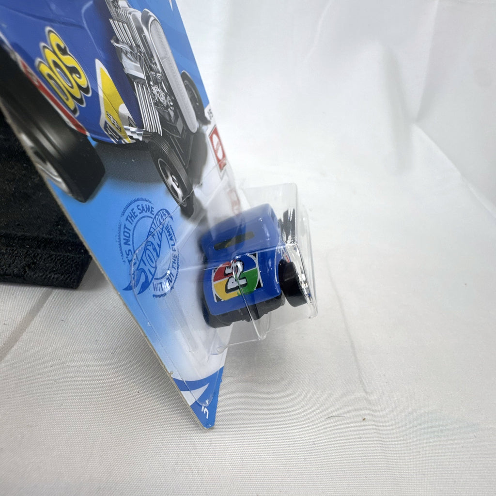 Sealed Hot Wheels 1932 Ford Coupe diecast car in blue with Mattel Games DOS card game graphics on original blister card.