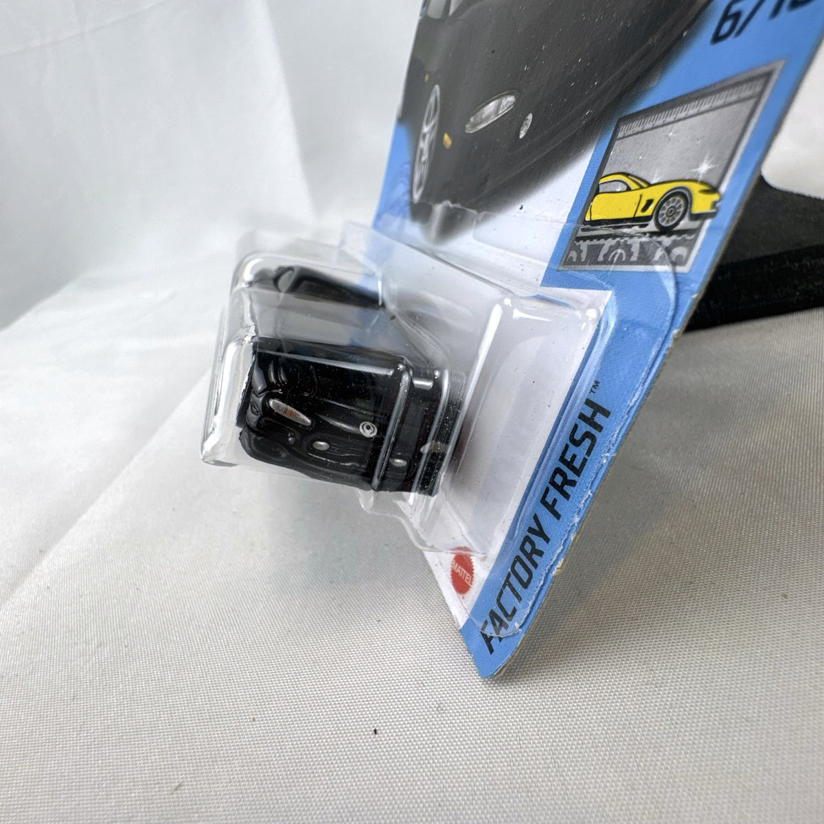 Hot Wheels 1995 Mazda RX-7 diecast 1:64 scale model car in black, sealed in original blister packaging.