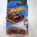 Sealed 1:64 scale Hot Wheels Grand Cross diecast car in metallic red with orange wheels and track stars graphics.