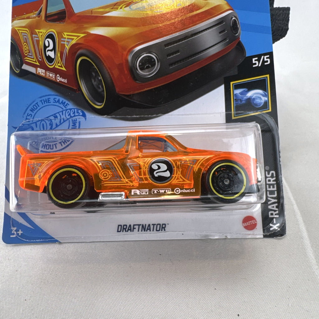 Hot Wheels 2021 Draftnator X-Raycers diecast race truck in translucent orange sealed on card