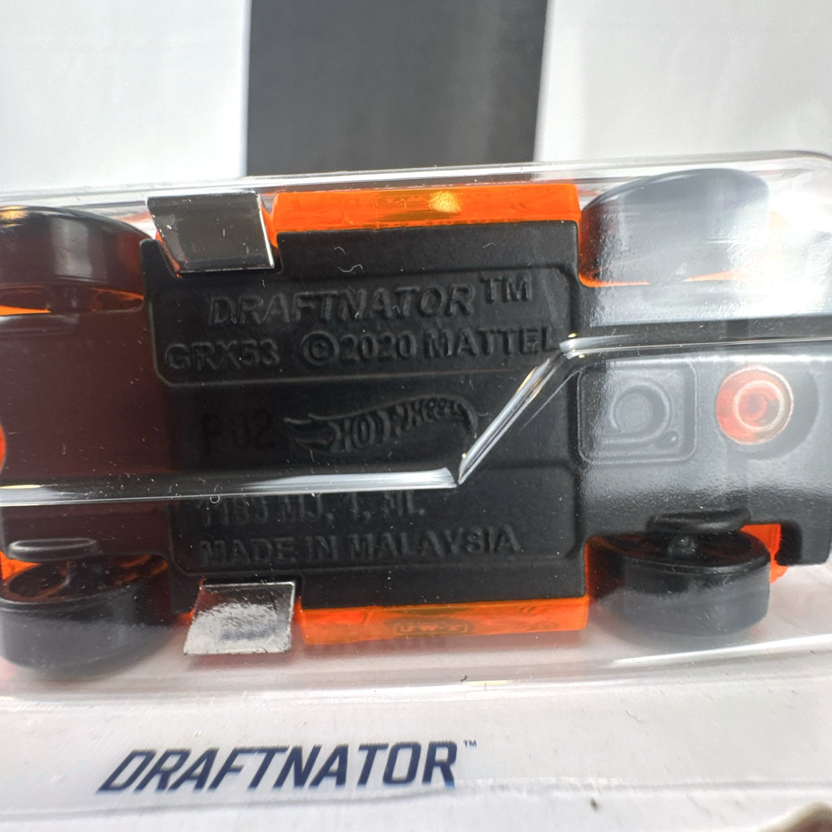 Hot Wheels 2021 Draftnator X-Raycers diecast race truck in translucent orange sealed on card