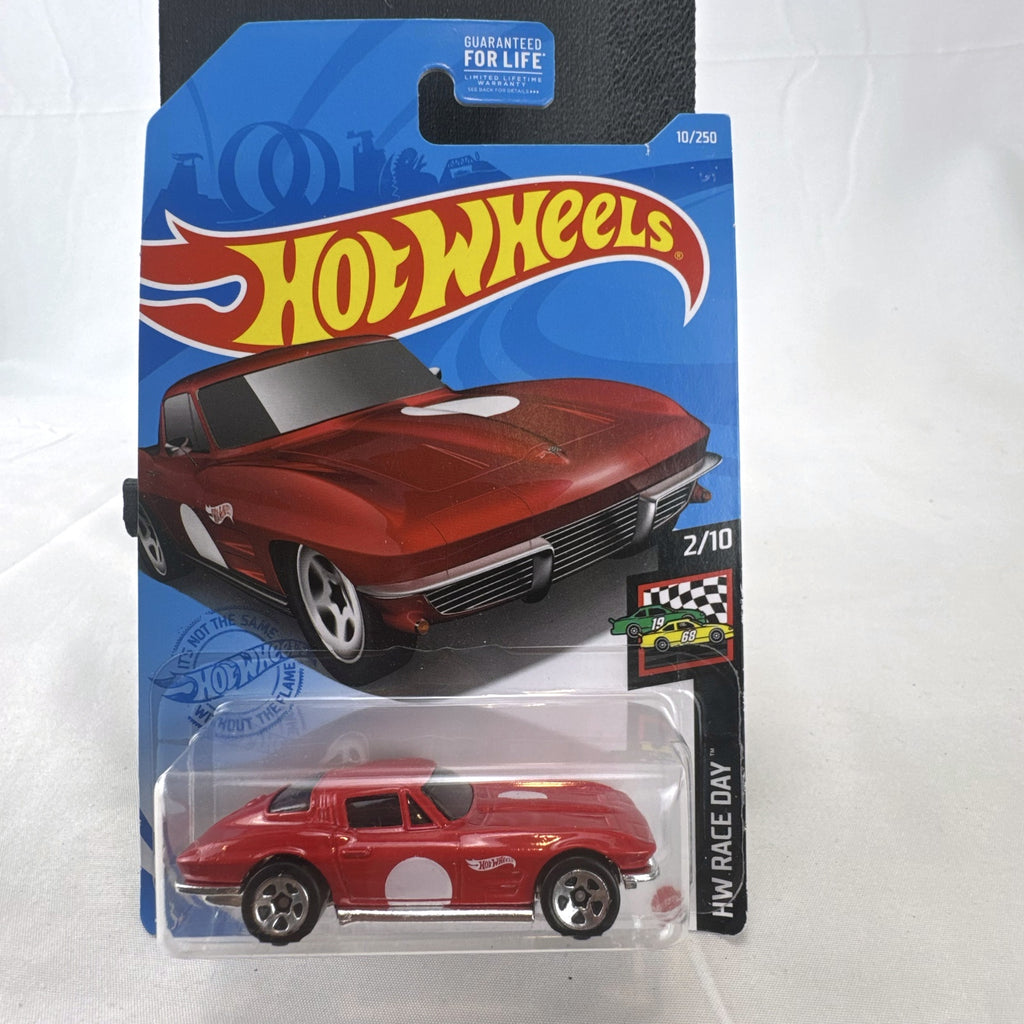 Hot Wheels 1964 Chevrolet Corvette Sting Ray diecast car in red, factory sealed on HW Race Day blister card