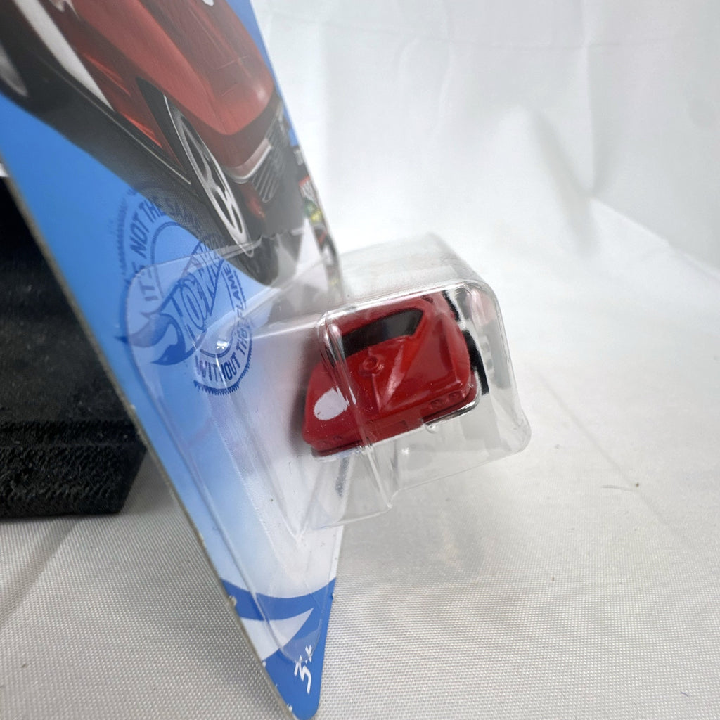 Hot Wheels 1964 Chevrolet Corvette Sting Ray 1:64 scale diecast car in red, sealed on original HW Race Day card package.