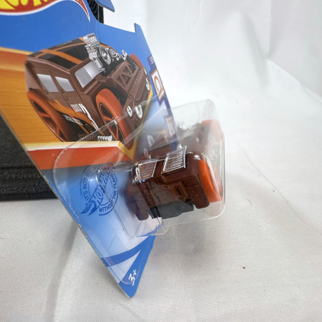 Sealed 2021 Hot Wheels Lethal Diesel diecast model car in matte brown with orange graphics and exposed twin turbo engine.