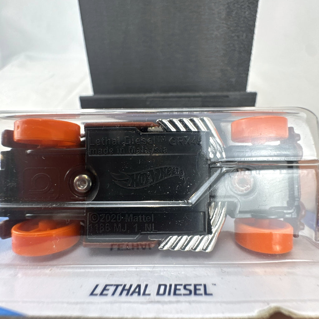 Sealed 2021 Hot Wheels Lethal Diesel diecast model car in matte brown with orange graphics and exposed twin turbo engine.