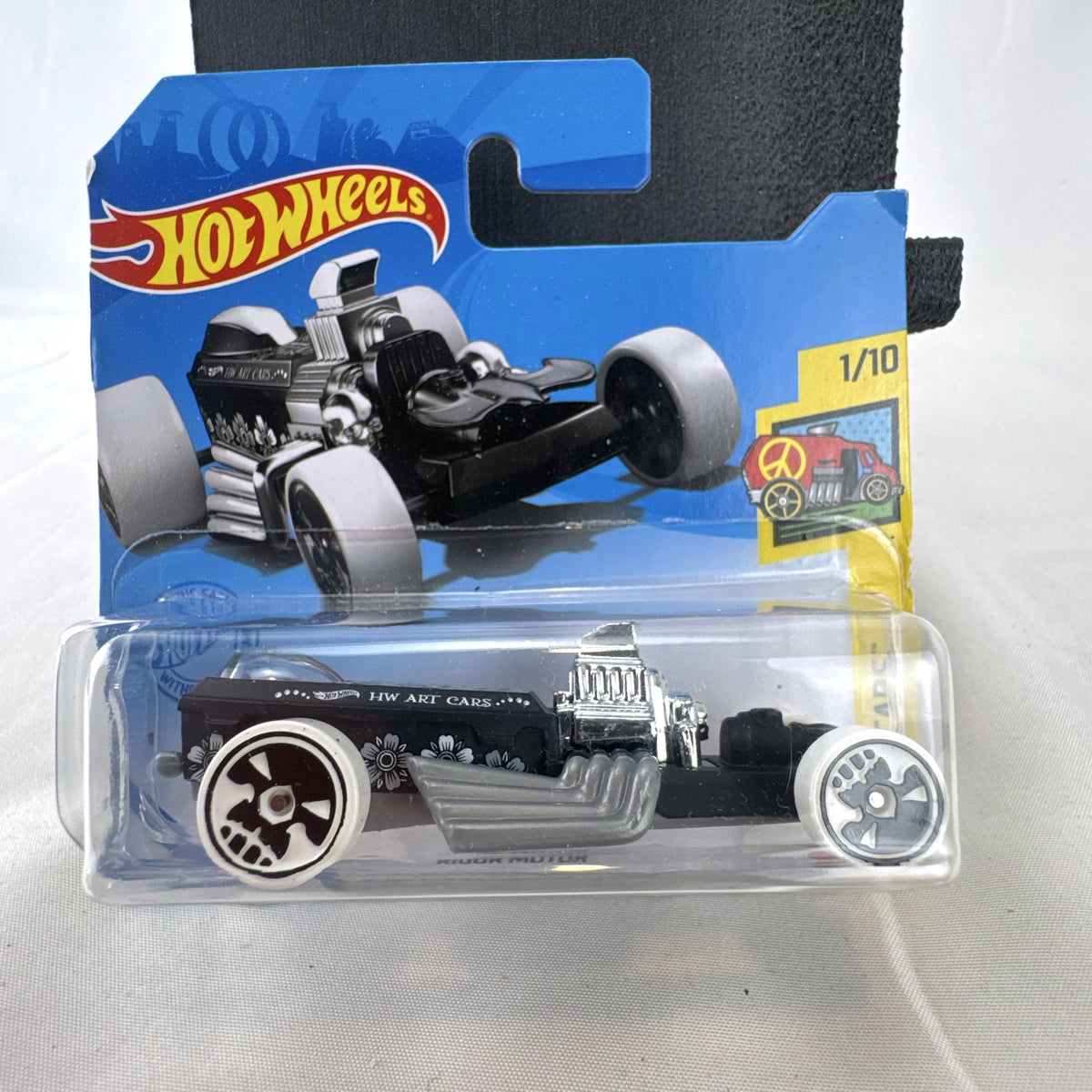 Hot Wheels 2021 Rigor Motor HW Art Cars 1:64 scale diecast car in black with skull wheels on blister card