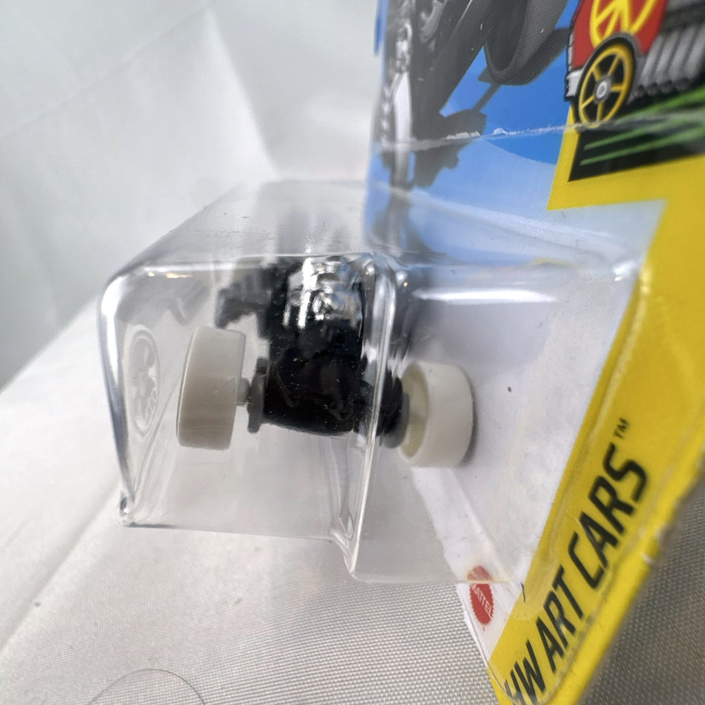 Hot Wheels 2021 Rigor Motor HW Art Cars 1:64 scale diecast car in black with skull wheels on blister card