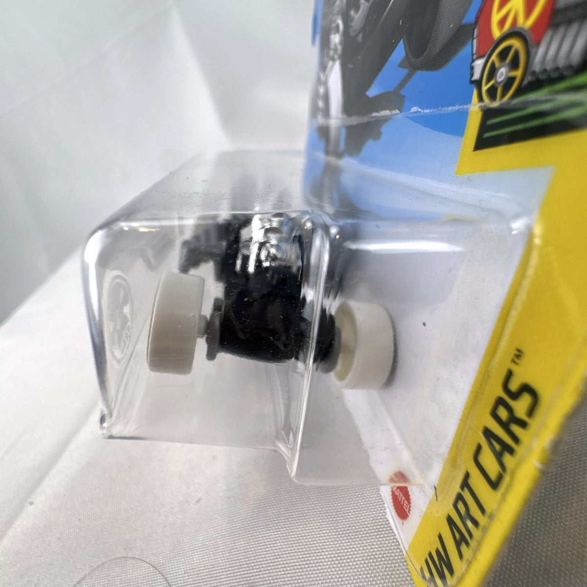 Hot Wheels 2021 Rigor Motor HW Art Cars 1:64 scale diecast car in black with skull wheels on blister card