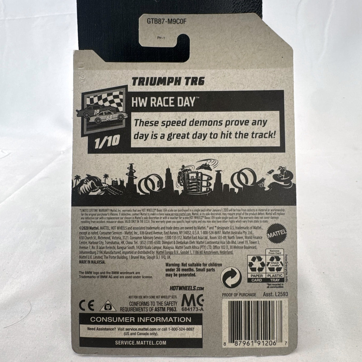 Hot Wheels Triumph TR6 HW Race Day diecast car in deep maroon red with racing stripes in original blister card packaging