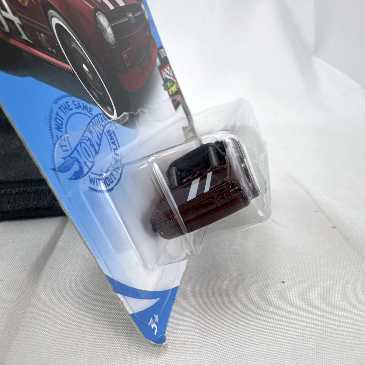 Hot Wheels Triumph TR6 HW Race Day diecast car in deep maroon red with racing stripes in original blister card packaging