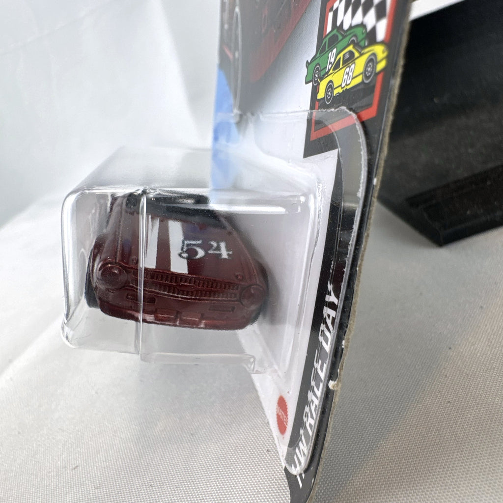 Hot Wheels Triumph TR6 HW Race Day diecast car in deep maroon red with racing stripes in original blister card packaging