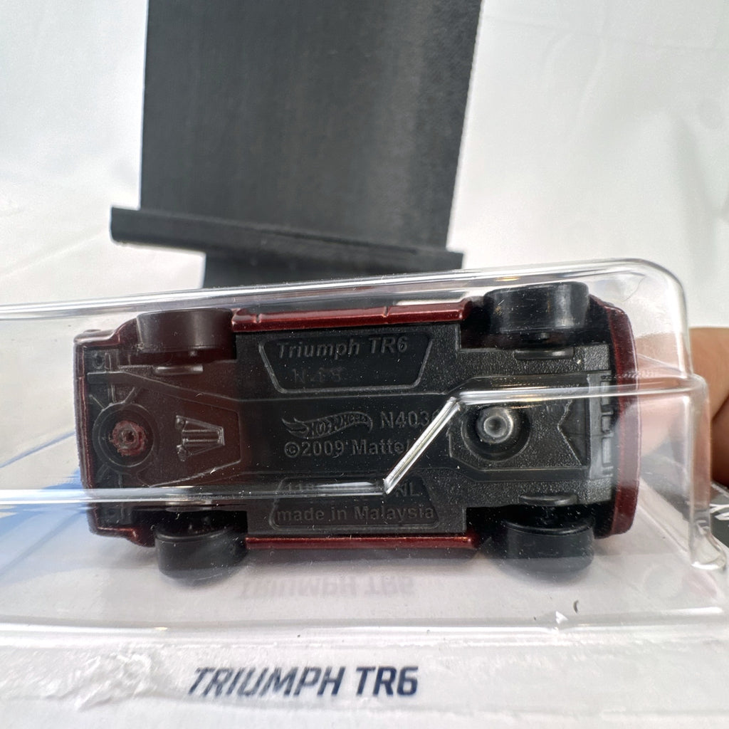 Hot Wheels 2021 HW Race Day Triumph TR6 diecast car in maroon red on original blister card