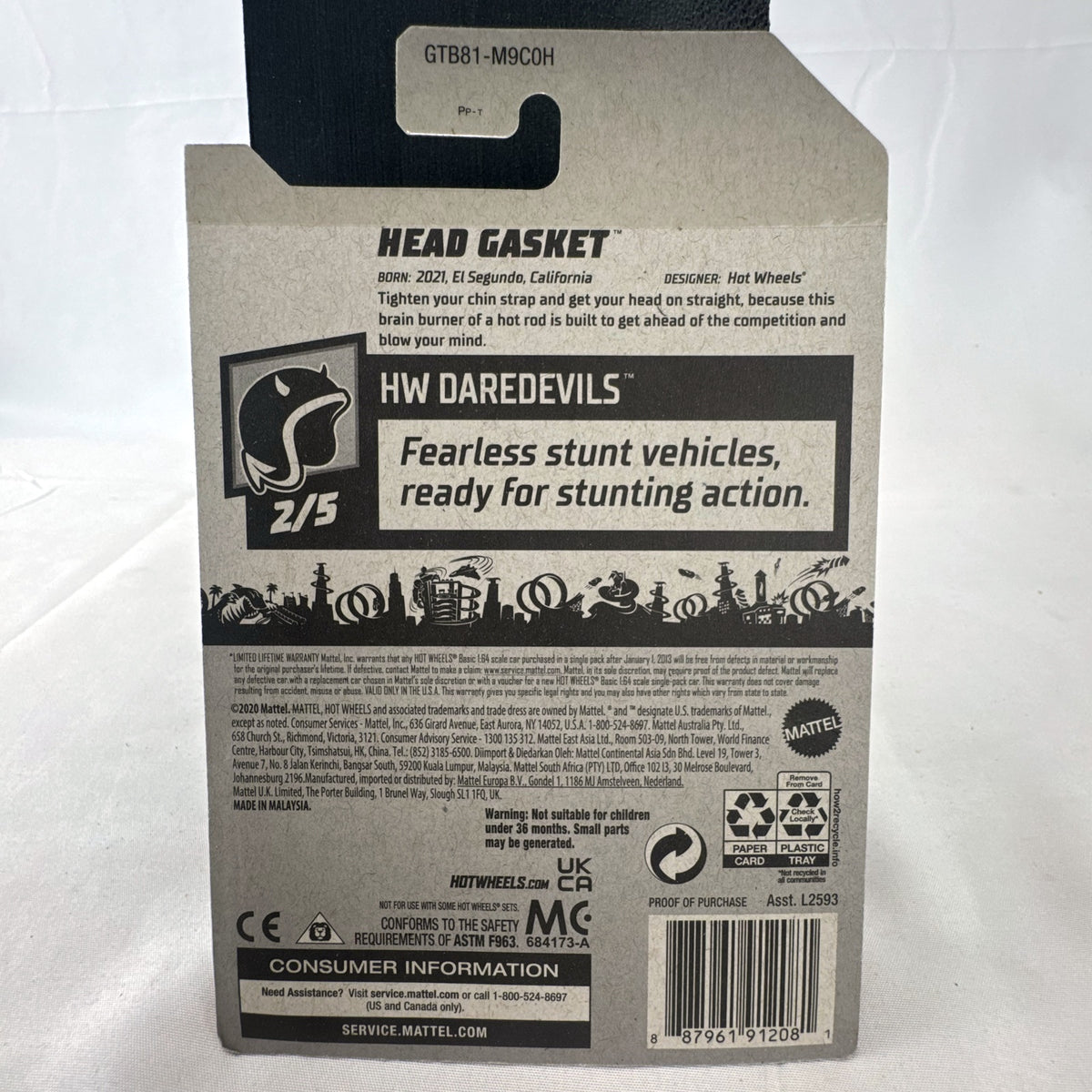 Hot Wheels 2021 Head Gasket white helmet diecast hot rod car in sealed original blister card packaging.