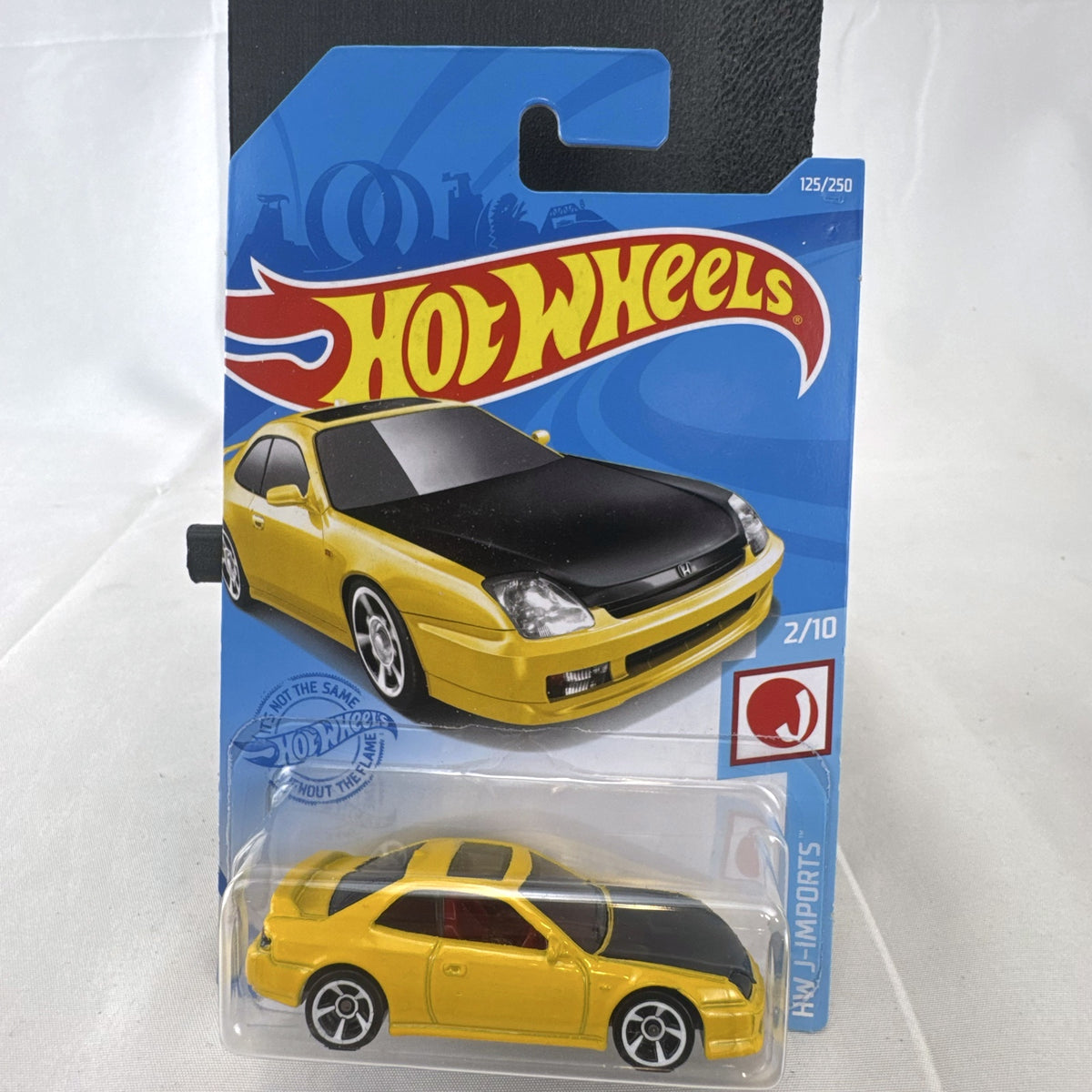Hot Wheels 1:64 scale 1998 Honda Prelude diecast car in bright yellow with black hood on packaging