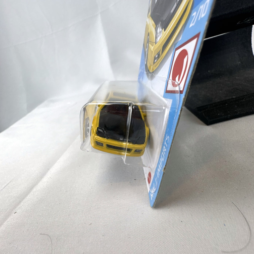 Hot Wheels 1:64 scale 1998 Honda Prelude diecast car in bright yellow with black hood on packaging