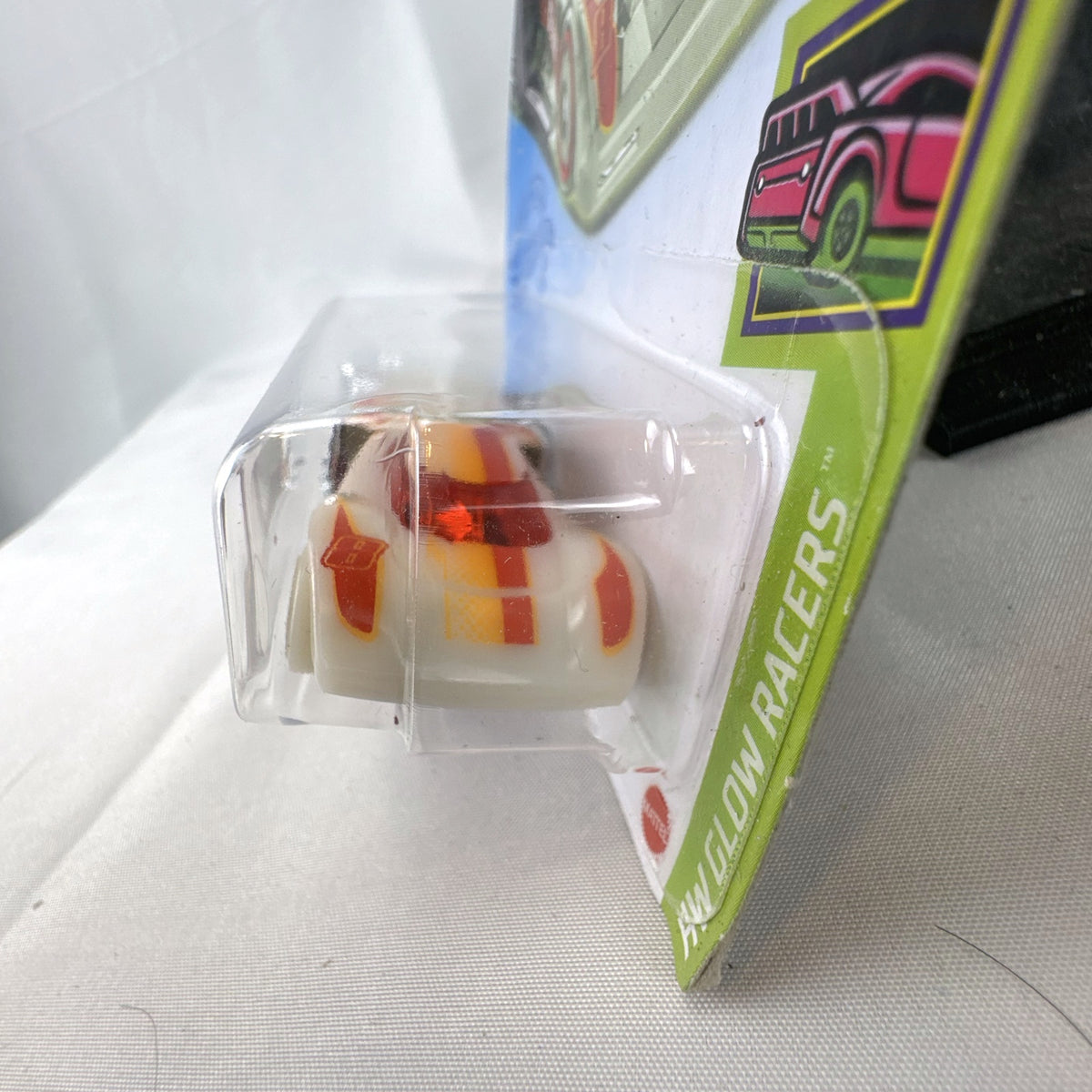 Hot Wheels Lindster Prototype 1:64 diecast car in glow white on original card
