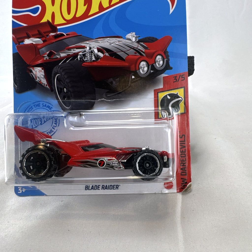 Sealed 2021 Hot Wheels Blade Raider red stunt buggy die-cast vehicle in original blister card packaging.