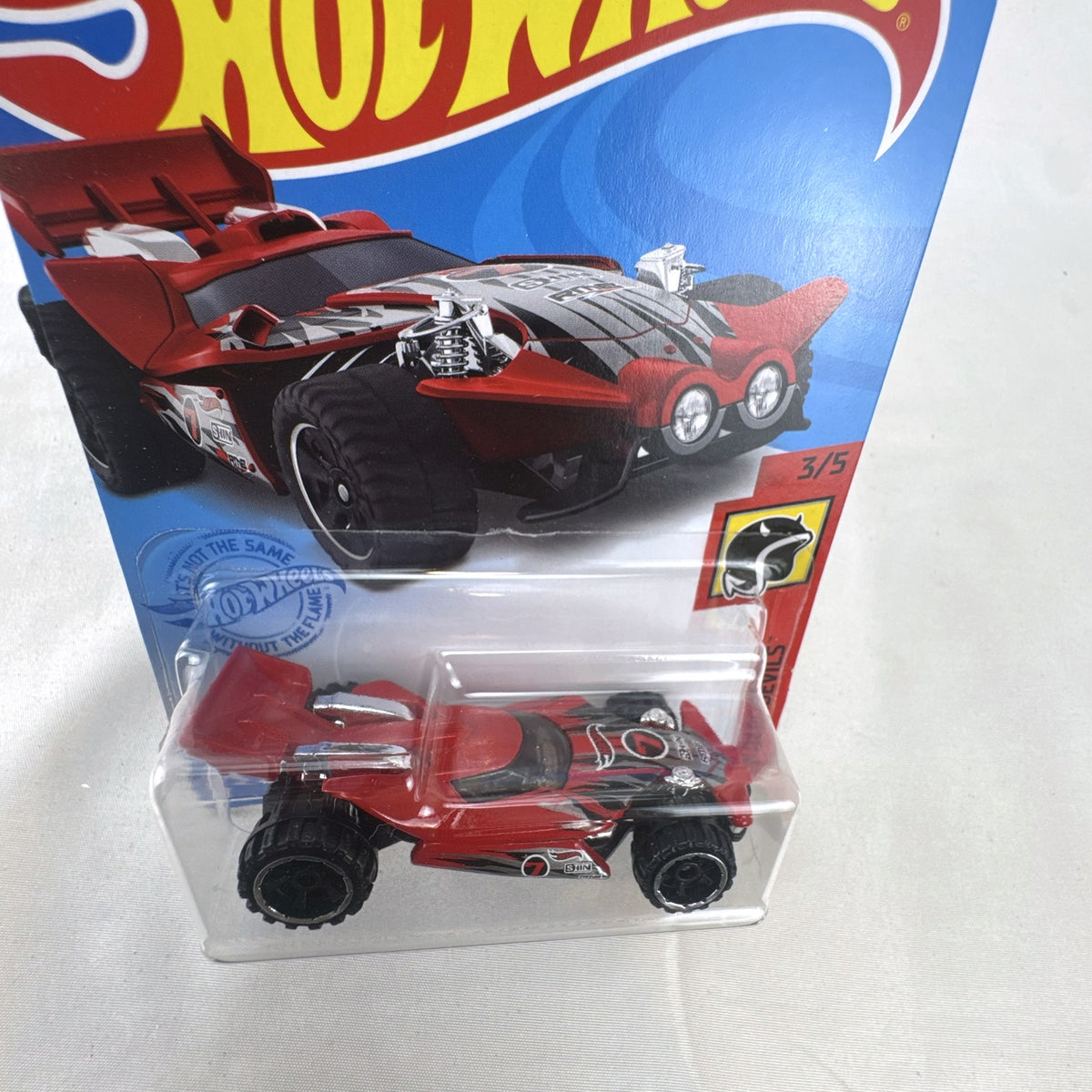 Sealed 2021 Hot Wheels Blade Raider red stunt buggy die-cast vehicle in original blister card packaging.