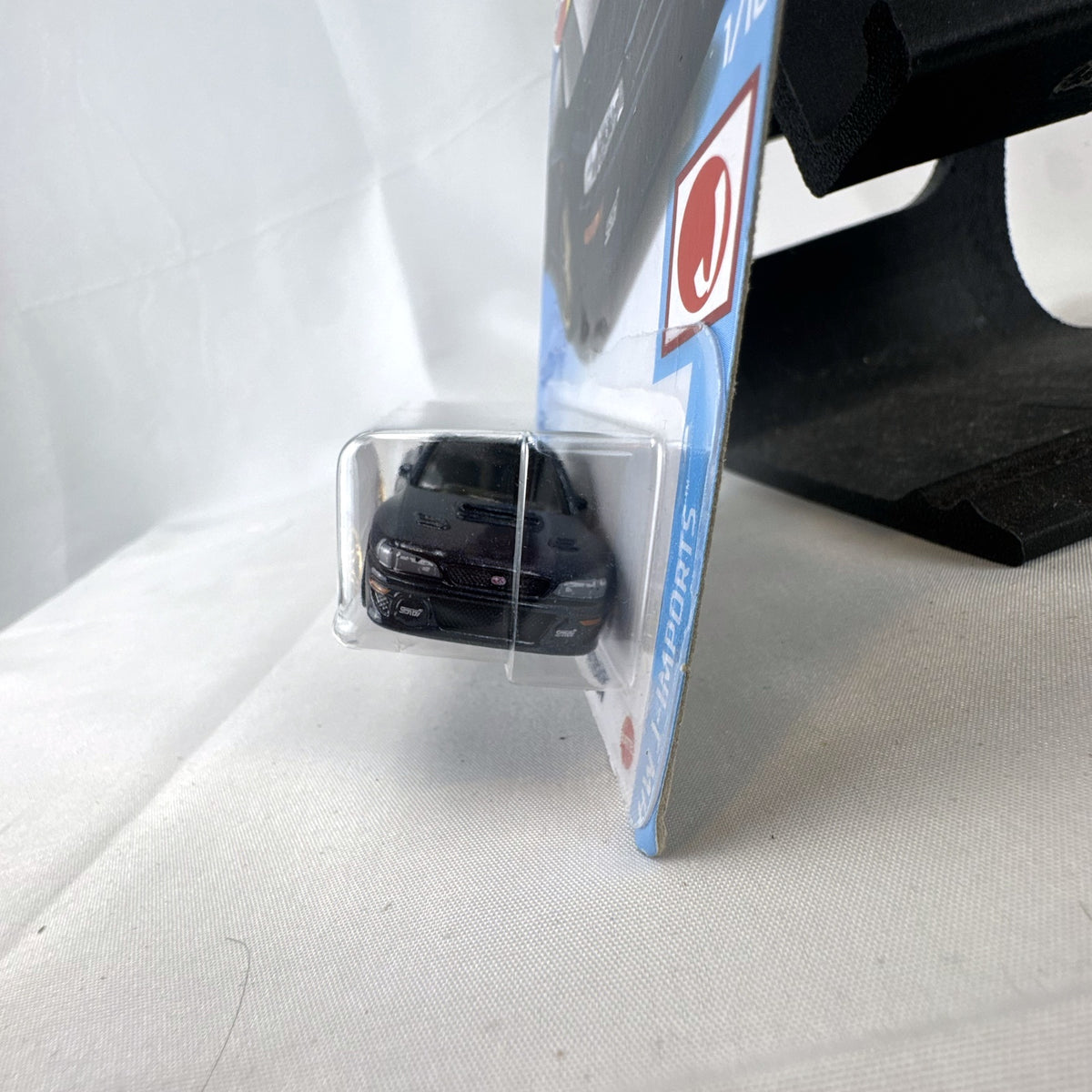 Hot Wheels 1998 Subaru Impreza 22B STi 1:64 scale diecast car in metallic blue on original card