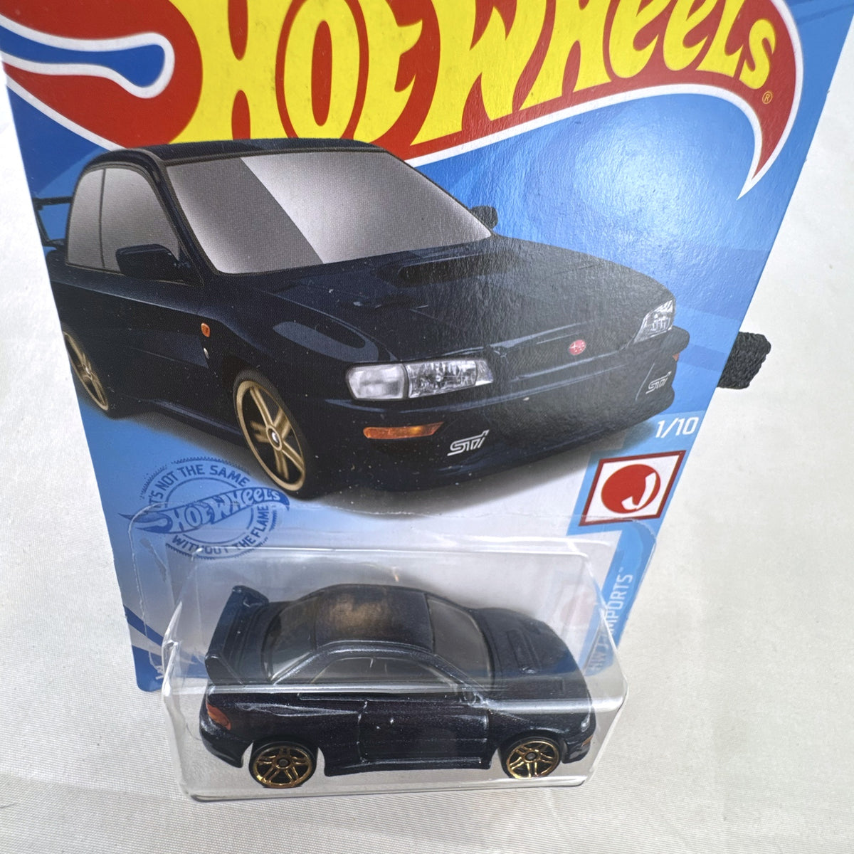 Hot Wheels 1998 Subaru Impreza 22B STi 1:64 scale diecast car in metallic blue on original card