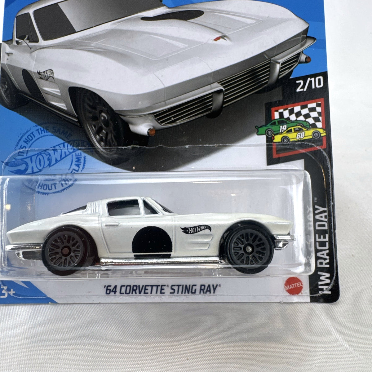 Sealed Hot Wheels 1964 Chevy Corvette Sting Ray HW Race Day 1:64 scale diecast car in white