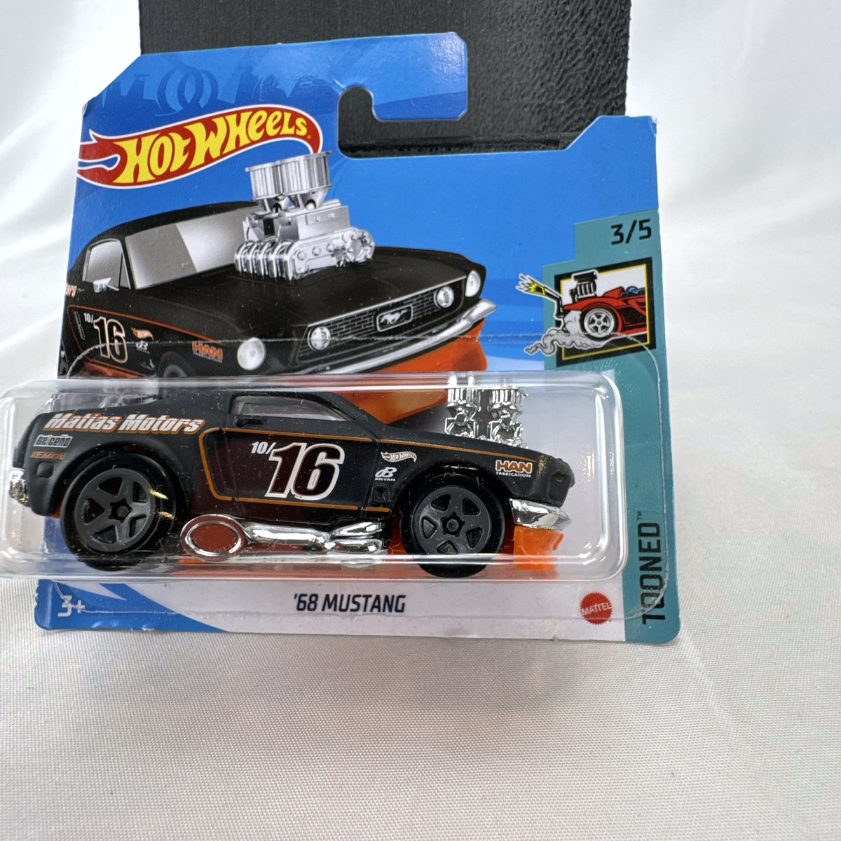 Hot Wheels 1968 Ford Mustang Tooned diecast car in black on short card blister pack