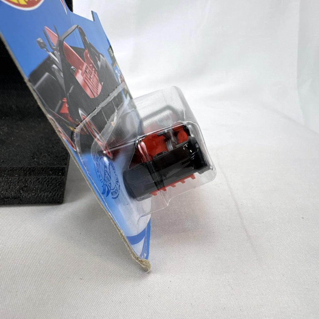 Hot Wheels Deora III 1:64 scale diecast car in black on factory-sealed international short card packaging