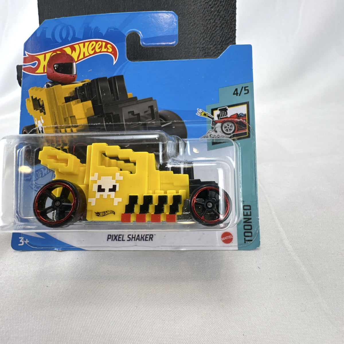 Hot Wheels Pixel Shaker 1:64 scale yellow diecast car in original sealed blister pack