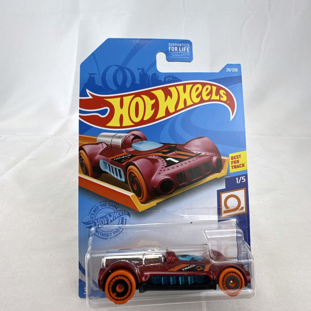 Hot Wheels Retro-Active diecast car in metallic maroon on original Track Stars blister card packaging.