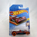 Hot Wheels Retro-Active diecast car in metallic maroon on original Track Stars blister card packaging.