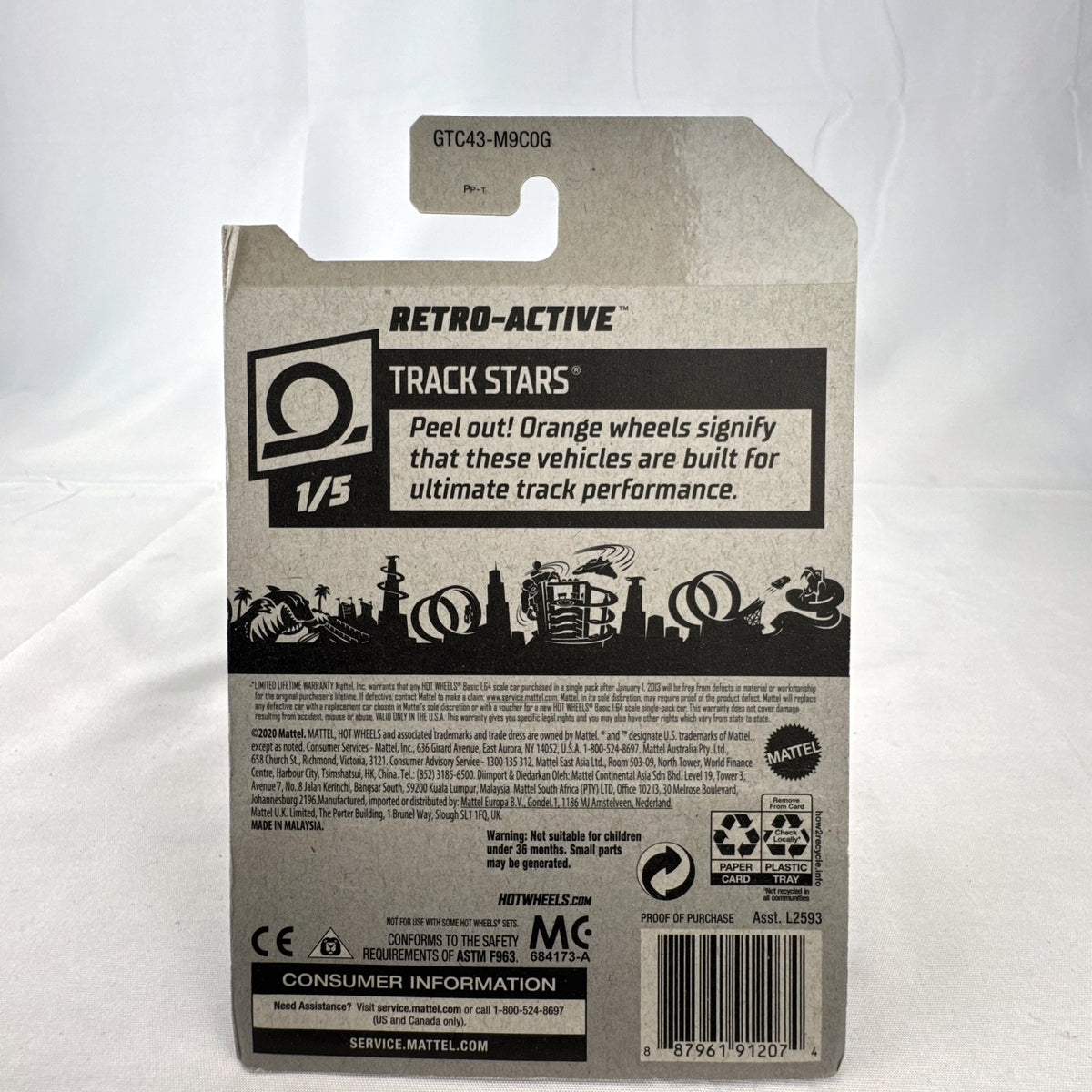 Hot Wheels Retro-Active diecast car in metallic maroon on original Track Stars blister card packaging.